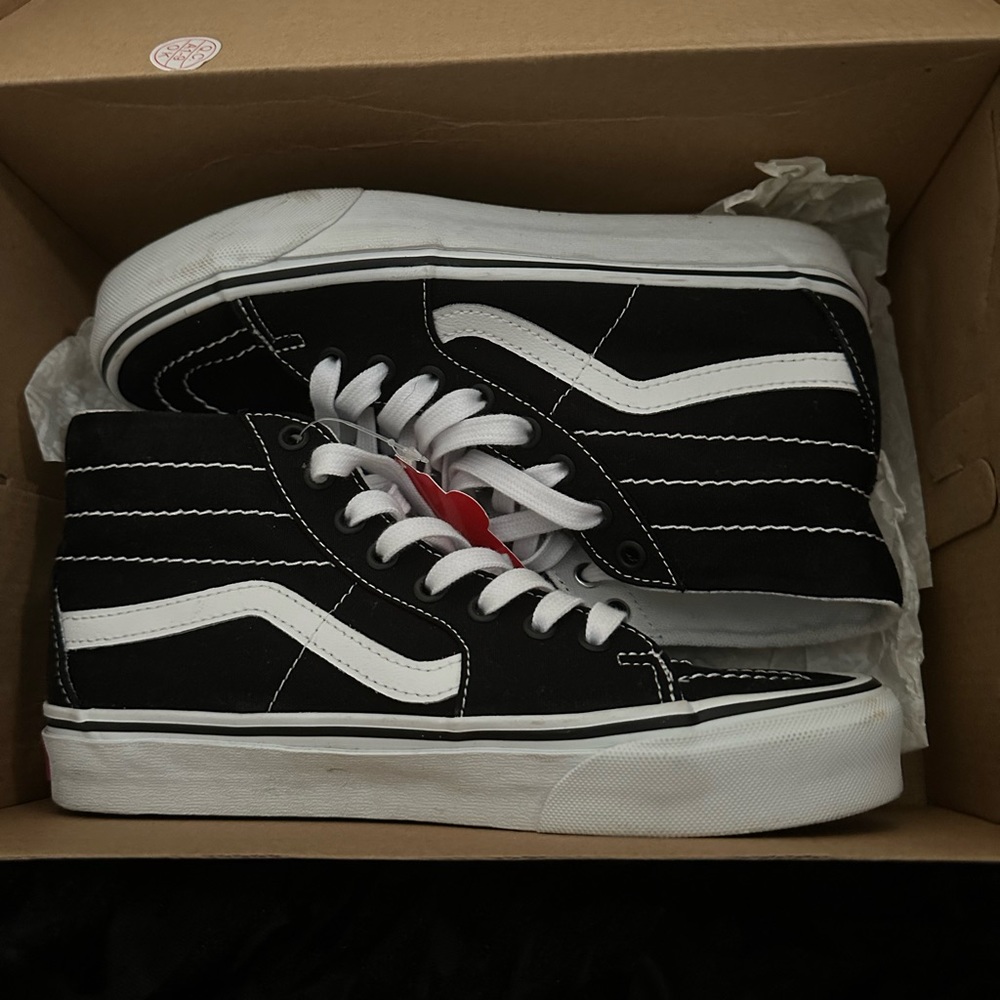 Black and white Sk8-Hi Vans